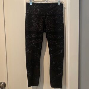 Lululemon leggings Size 10.  Black with gray lines.  Mesh detail on the front.